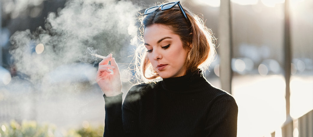 woman smoking on the street