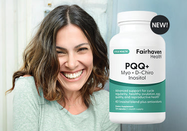Woman smiling next to a bottle of Fairhaven Health PQQ+ supplement.