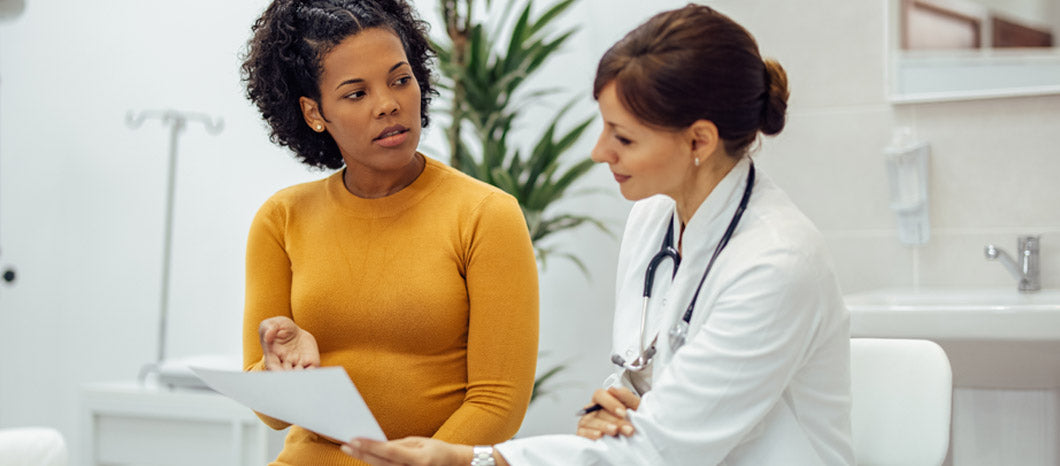 woman discussing AMH test with doctor