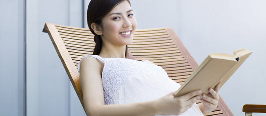 pregnant woman reading breastfeeding guide