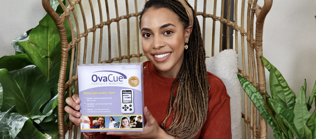 woman holding OvaCue fertility monitor