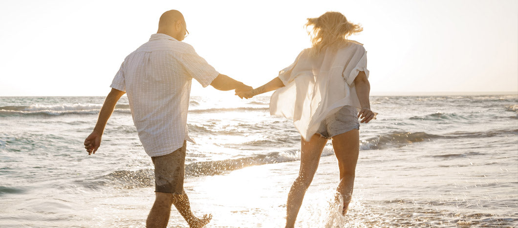 TTC couple on beach during summer travel