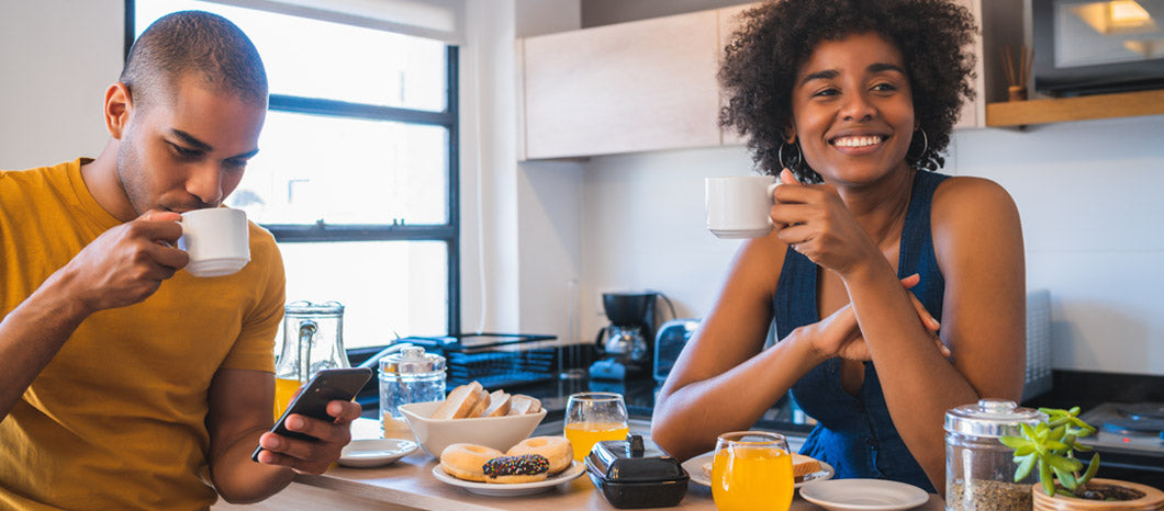 couple waiting at home eating breakfast
