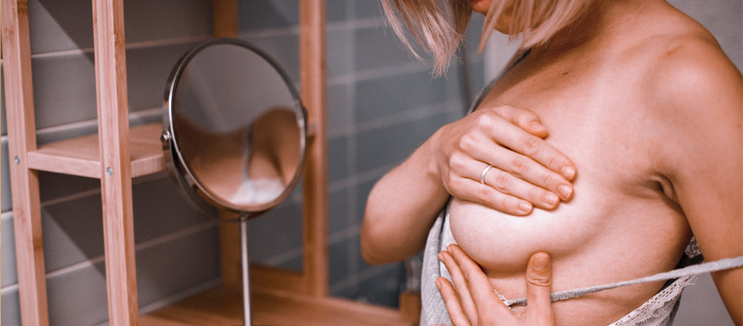 woman checking her engorged breast